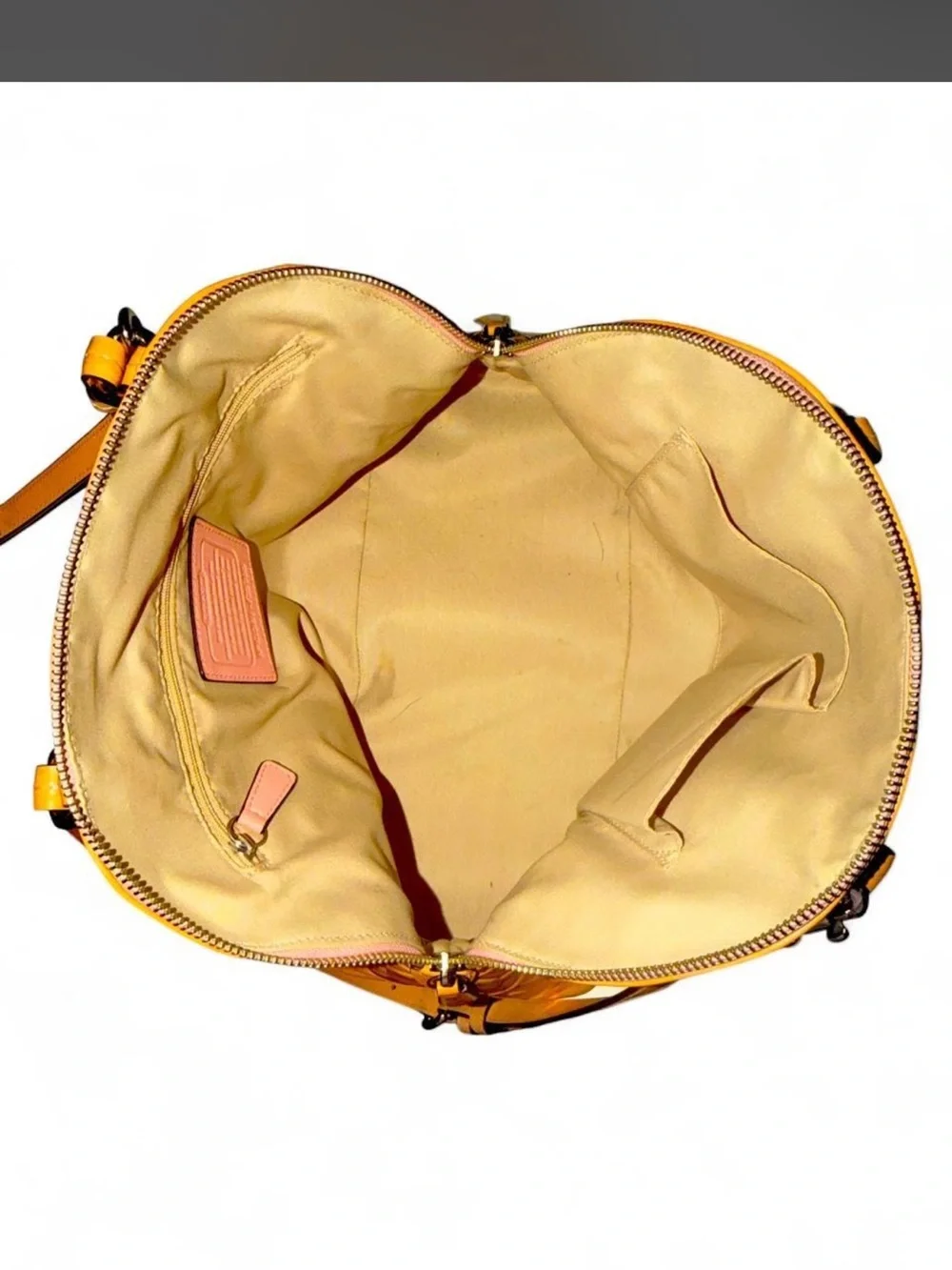 Coach - Peyton Cora in Tan Glossy PVC crossbody with a metallic finish